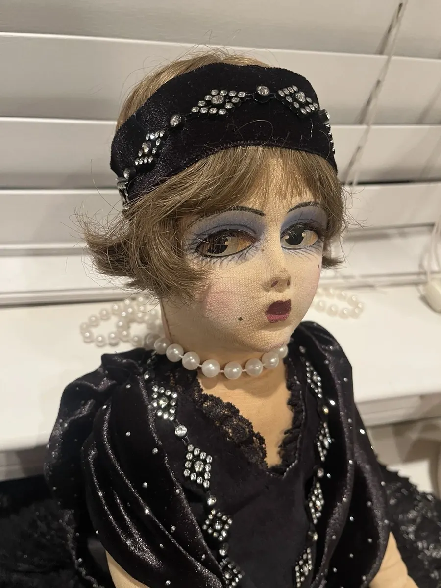 Boudoir Gerling doll in a black outfit, head and upper-body view.