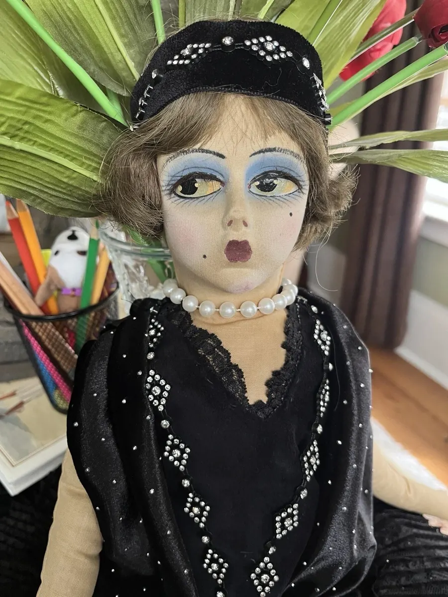 Boudoir Gerling doll in a black outfit, close upper-body view.